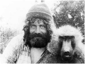 Sapolsky with one of the baboons he studied (and proof we're all related).